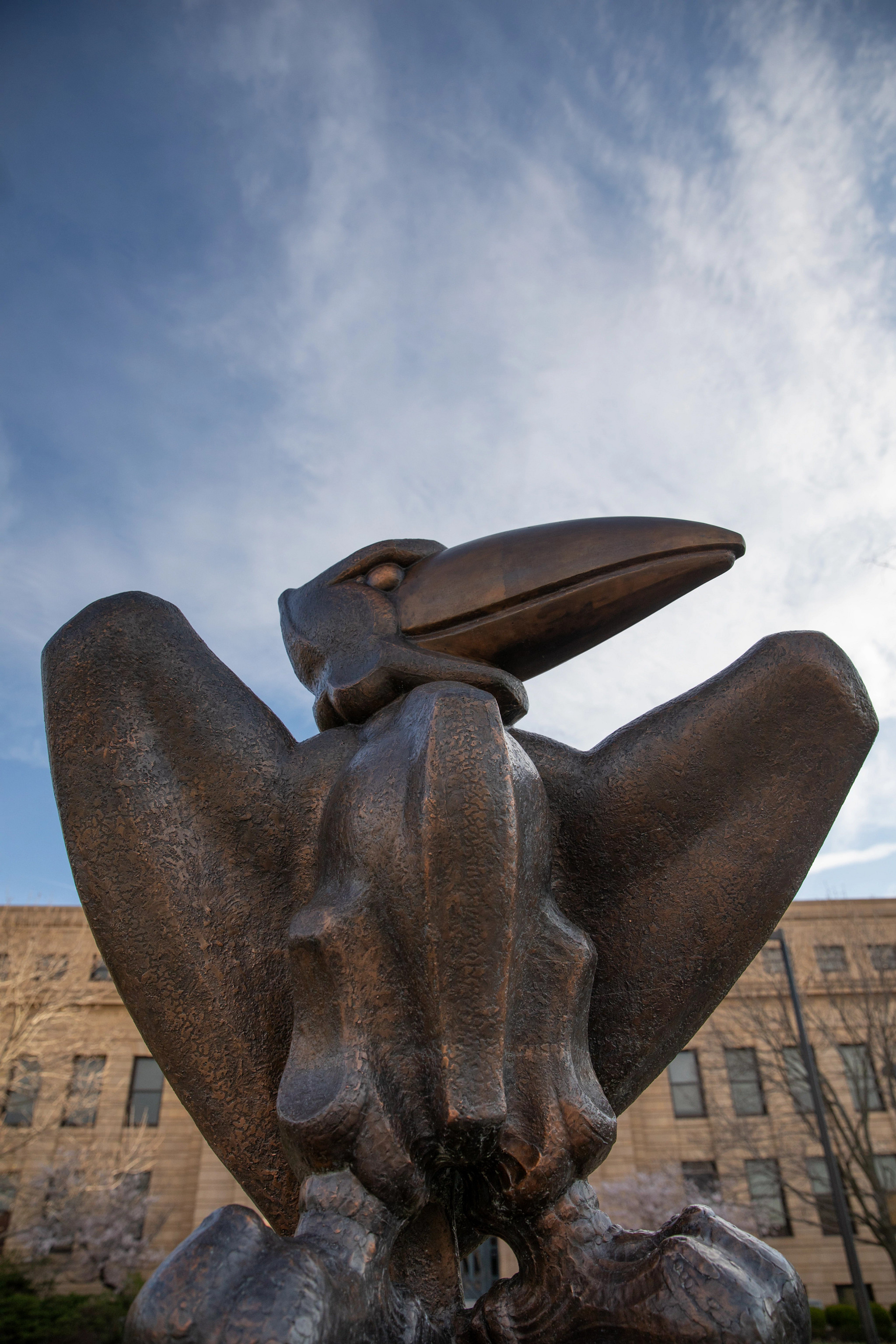 Bronze Jayhawk in front of Strong Hall